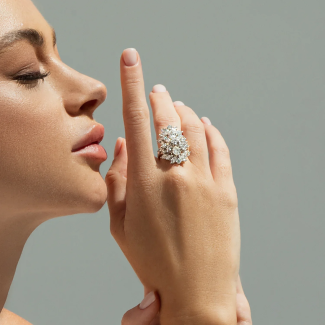 Woman wearing gold jewelry and rings